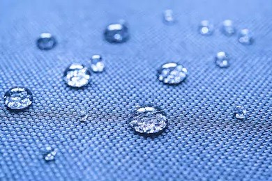 Beading water drops on water-repellent material.