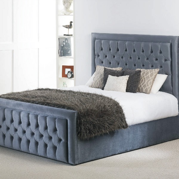 Blue button bed with foot board and tall headboard