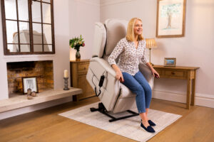 Blonde woman being lifted in riser recliner. 